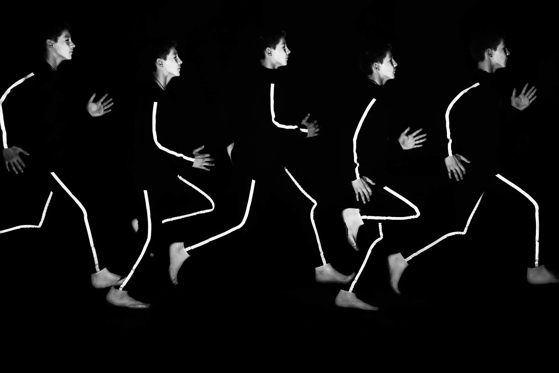 group of kids and coach demonstrating coordinated movement exercise in studio